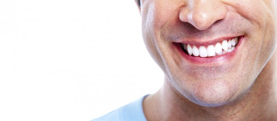 Man with a healty teeth smile. Isolated over white background.